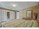 Bedroom featuring textured wallpaper, a bamboo mirror, and mirrored closet doors at 4701 N Kings Hwy. # 8, Myrtle Beach, SC 29577