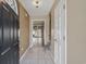 Inviting foyer with neutral tile flooring, stairs and an open view to living area at 4701 N Kings Hwy. # 8, Myrtle Beach, SC 29577