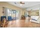 Bright living room with sliding doors and natural light shining on the hardwood floors at 4701 N Kings Hwy. # 8, Myrtle Beach, SC 29577