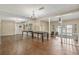 Spacious living room featuring hardwood floors, chandelier, and mirrored wall at 4701 N Kings Hwy. # 8, Myrtle Beach, SC 29577