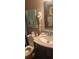 Well-lit bathroom featuring a sleek vanity with a marble countertop, a medicine cabinet, and stylish decor at 4719 Cobblestone Dr. # C4, Myrtle Beach, SC 29575