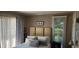 A serene bedroom offers a comfortable bed, soft natural light and a relaxing atmosphere at 4719 Cobblestone Dr. # C4, Myrtle Beach, SC 29575
