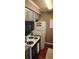 A bright kitchen features sleek appliances, wood-look flooring and stylish cabinets at 4719 Cobblestone Dr. # C4, Myrtle Beach, SC 29575