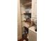 A compact laundry room with a stacked washer and dryer, providing efficient space-saving convenience at 4719 Cobblestone Dr. # C4, Myrtle Beach, SC 29575