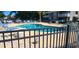 Community pool area features ample seating and a meticulously maintained deck, surrounded by a secure fence at 4719 Cobblestone Dr. # C4, Myrtle Beach, SC 29575