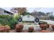 Cobblestone community entrance sign flanked by greenery and seasonal decorations, creating a welcoming atmosphere at 4719 Cobblestone Dr. # C4, Myrtle Beach, SC 29575