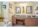 Inviting bathroom featuring a double vanity with granite counters and decorative wall accents at 4726 Southern Trail, Myrtle Beach, SC 29579