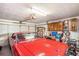 Spacious garage with classic red car, storage cabinets, and ample space for tools and equipment at 4726 Southern Trail, Myrtle Beach, SC 29579