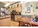 Open concept kitchen with wooden cabinets, stainless steel appliances, and dining table at 4726 Southern Trail, Myrtle Beach, SC 29579