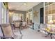 Cozy screened sunroom with neutral colors and comfortable seating for enjoying the outdoors at 4726 Southern Trail, Myrtle Beach, SC 29579