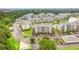 Stunning aerial view of condo community surrounded by lush landscaping and a tranquil pond at 4865 Luster Leaf Circle # 402, Myrtle Beach, SC 29577