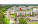 Aerial view of a condo complex, with landscaped grounds, assigned parking, and well maintained exteriors at 4865 Luster Leaf Circle # 402, Myrtle Beach, SC 29577