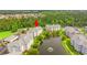 Aerial view of property showcasing beautiful landscaping, pond, and spacious condo buildings at 4865 Luster Leaf Circle # 402, Myrtle Beach, SC 29577