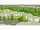 Scenic aerial view of a condo complex surrounding a pond with mature trees and lush green landscaping at 4865 Luster Leaf Circle # 402, Myrtle Beach, SC 29577