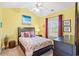 Bright bedroom with yellow walls, a dark wood bed, and beach-themed decor at 4865 Luster Leaf Circle # 402, Myrtle Beach, SC 29577