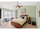 Cozy bedroom with a ceiling fan, bay window, and comfortable furnishings at 4865 Luster Leaf Circle # 402, Myrtle Beach, SC 29577
