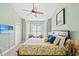 Comfortable bedroom featuring natural light, bay window, and coastal inspired décor at 4865 Luster Leaf Circle # 402, Myrtle Beach, SC 29577