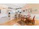 Dining area with a glass-top table, wooden chairs, and a view of the kitchen at 4865 Luster Leaf Circle # 402, Myrtle Beach, SC 29577