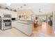Open-concept kitchen with granite countertops, stainless appliances, and a view of the living room at 4865 Luster Leaf Circle # 402, Myrtle Beach, SC 29577
