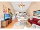Bright, open-concept living room and kitchen with hardwood floors, vaulted ceilings, and coastal decor at 4865 Luster Leaf Circle # 402, Myrtle Beach, SC 29577