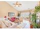 Spacious living room with hardwood floors, comfortable seating, and a sliding door to an outdoor patio at 4865 Luster Leaf Circle # 402, Myrtle Beach, SC 29577