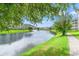 Scenic pond view with a fountain, surrounded by well-maintained green lawns and condo buildings at 4865 Luster Leaf Circle # 402, Myrtle Beach, SC 29577
