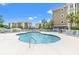 Community pool with lounge chairs and palm trees, offering a relaxing outdoor experience at 4865 Luster Leaf Circle # 402, Myrtle Beach, SC 29577