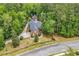 Aerial view of a beautiful brick home with a pool surrounded by lush green trees at 487 Trestle Way, Conway, SC 29526