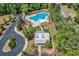 Aerial view of community pool and clubhouse with ample seating and playground at 487 Trestle Way, Conway, SC 29526