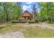 Charming two-story home with mature trees, and a lush front yard at 487 Trestle Way, Conway, SC 29526