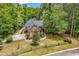 Beautiful brick home on landscaped grounds with mature trees and black metal fencing at 487 Trestle Way, Conway, SC 29526