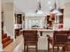 Gourmet kitchen with granite counters, dark wood cabinets, and bar seating at 487 Trestle Way, Conway, SC 29526