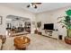 Open-concept living room with views into dining area and kitchen; featuring tile floors and a ceiling fan at 487 Trestle Way, Conway, SC 29526