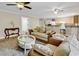 Inviting living room featuring plush seating, hardwood floors, and a combined kitchen view at 487 Trestle Way, Conway, SC 29526