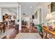 Spacious living room boasting hardwood floors, columns, and seamless transition to kitchen at 487 Trestle Way, Conway, SC 29526