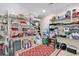 Organized walk-in pantry with shelves stocked with appliances, cookware, and serving dishes on top of tiled floor at 487 Trestle Way, Conway, SC 29526