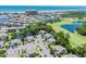 An aerial view of a residential area with a golf course, pond, and ocean in the background at 503 20Th Ave. N # 9D, North Myrtle Beach, SC 29582