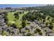 An aerial view of a residential area with a golf course and a pond near the ocean at 503 20Th Ave. N # 9D, North Myrtle Beach, SC 29582