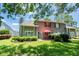 Well-maintained backyard featuring a patio, lush greenery, and mature trees, ideal for outdoor relaxation at 503 20Th Ave. N # 9D, North Myrtle Beach, SC 29582