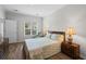 Comfortable bedroom featuring a large bed, hardwood floors, and a bright window at 503 20Th Ave. N # 9D, North Myrtle Beach, SC 29582