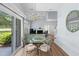 Open concept dining and living area filled with natural light, chandelier and sliding doors to the patio at 503 20Th Ave. N # 9D, North Myrtle Beach, SC 29582