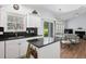 Bright kitchen with granite countertops, island, stainless steel appliances, and an adjacent dining area at 503 20Th Ave. N # 9D, North Myrtle Beach, SC 29582