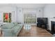 Bright living room with shutters on the window, a fireplace and sliding doors leading to the backyard patio at 503 20Th Ave. N # 9D, North Myrtle Beach, SC 29582