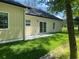 The sliding glass doors lead to a concrete patio from the backyard at 5310 Pauley Swamp Rd., Conway, SC 29527