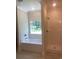 The bathroom includes a tub, a stand-up shower, and a window view at 5310 Pauley Swamp Rd., Conway, SC 29527