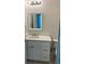 Bathroom vanity featuring a white cabinet, light countertop, and a framed mirror at 5310 Pauley Swamp Rd., Conway, SC 29527