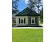 This home features a blend of siding and stone accents that enhance its exterior at 5310 Pauley Swamp Rd., Conway, SC 29527