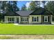 Charming single-story home showcasing a manicured lawn and inviting curb appeal at 5310 Pauley Swamp Rd., Conway, SC 29527