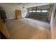 A spacious garage with a door and garage door, offering ample room for parking and storage at 5310 Pauley Swamp Rd., Conway, SC 29527