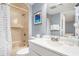 Bathroom with a shower/tub combo, a vanity, and calming blue accents at 5523 N Ocean Blvd. # 1410, Myrtle Beach, SC 29577